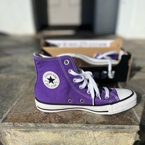 Purple high top Converse.